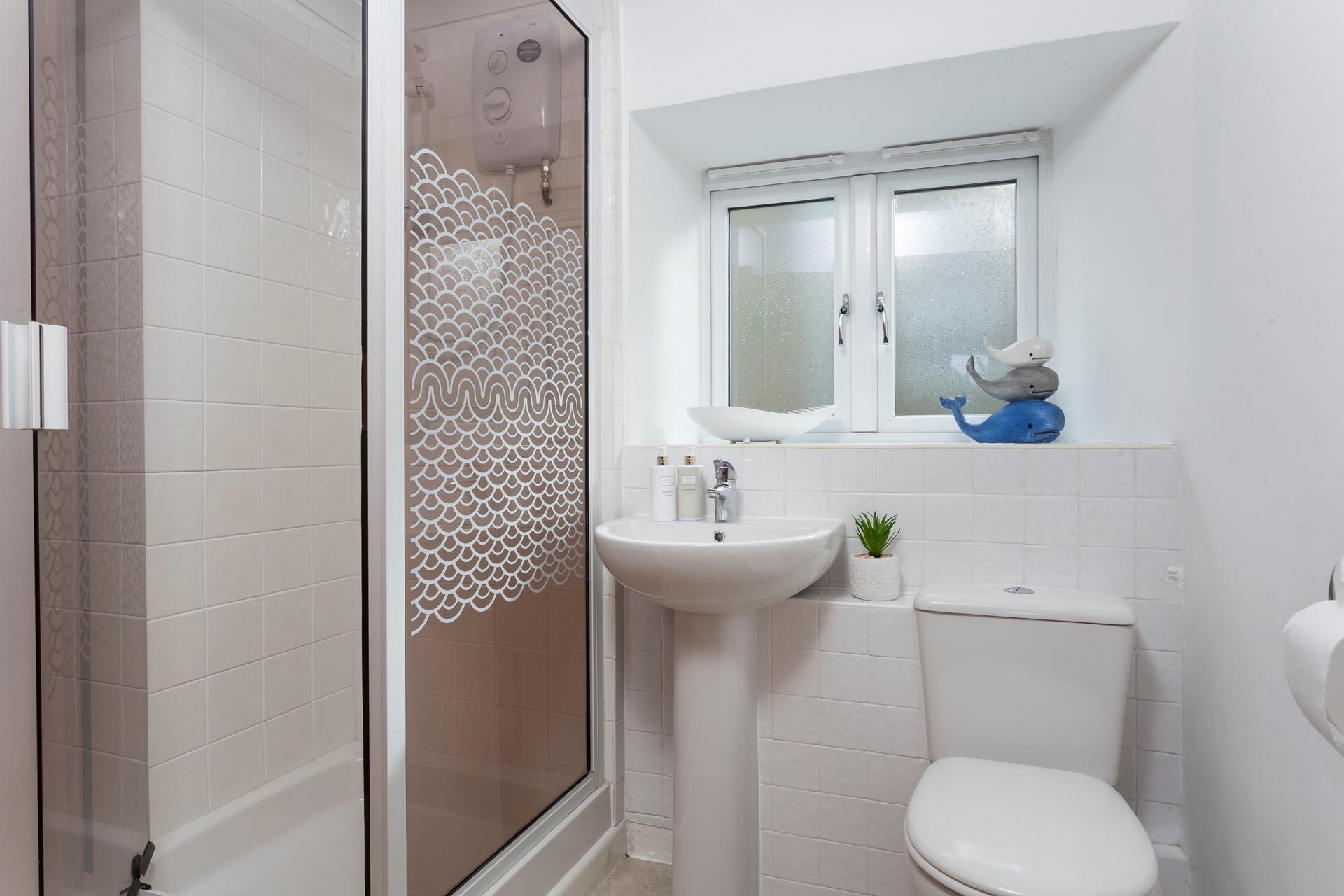 The ground floor shower room is conveniently located for rinsing off those sandy toes after a day at the beach.