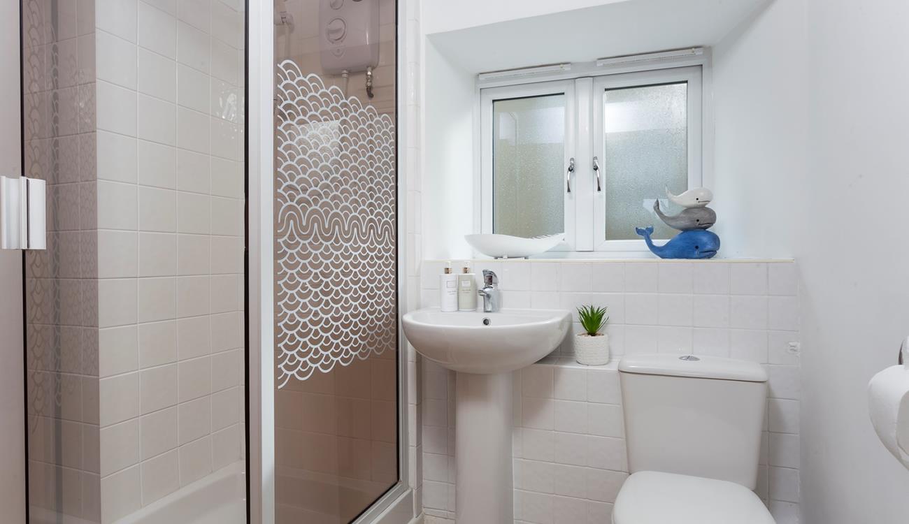 The ground floor shower room is conveniently located for rinsing off those sandy toes after a day at the beach.