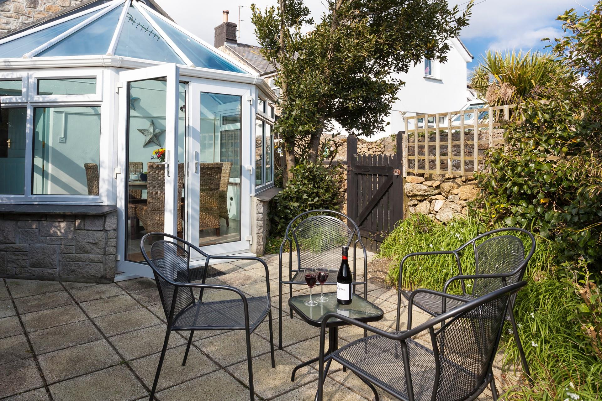 The secluded garden offers a private area for dining al fresco on those balmy summer evenings. 