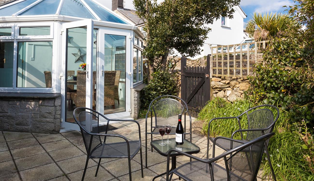 The secluded garden offers a private area for dining al fresco on those balmy summer evenings. 