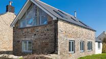 Traditional granite combined with modern features creates a statement on arrival at The Old Forge. 