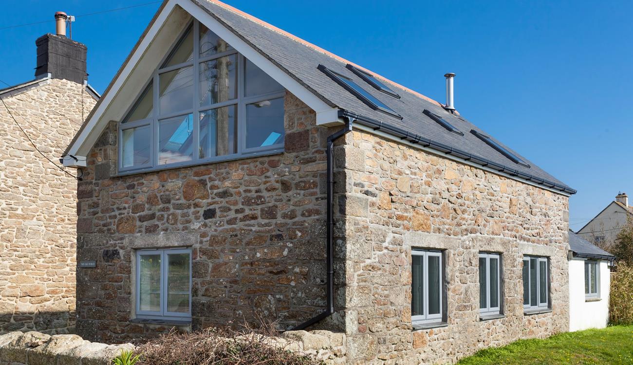 Traditional granite combined with modern features creates a statement on arrival at The Old Forge. 