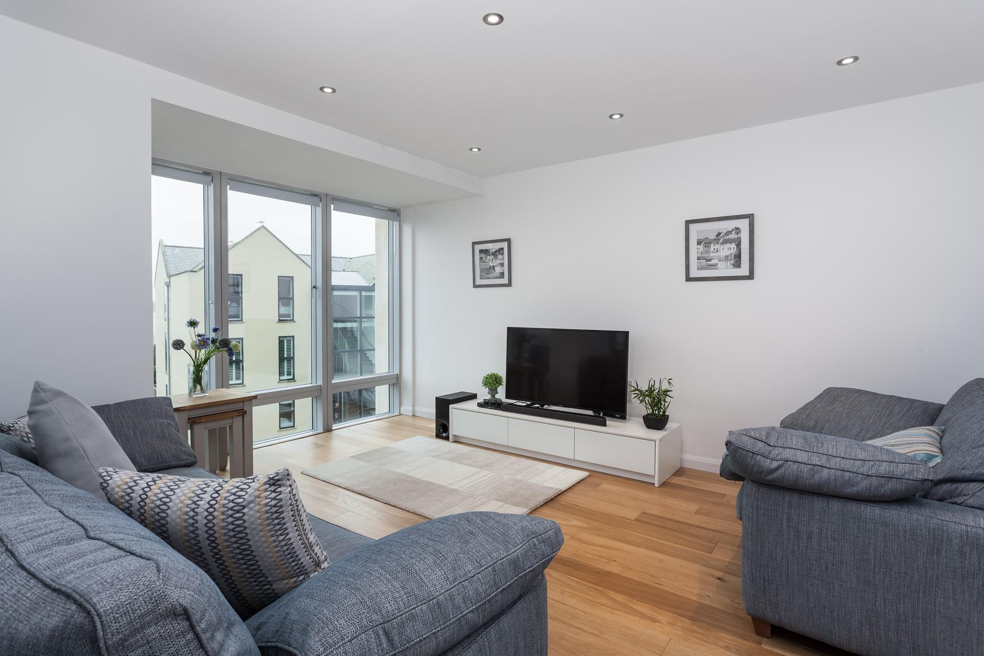 After a day spent at the beach come back to your apartment and sink into the sofa with a good film on the TV.