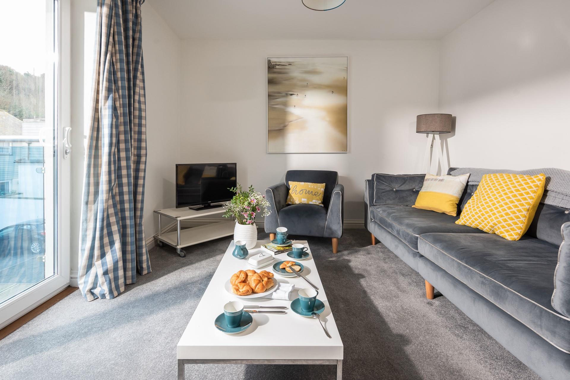 The cosy living room is the perfect base to relax after spending your days at the beach.