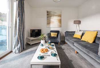 The cosy living room is the perfect base to relax after spending your days at the beach.