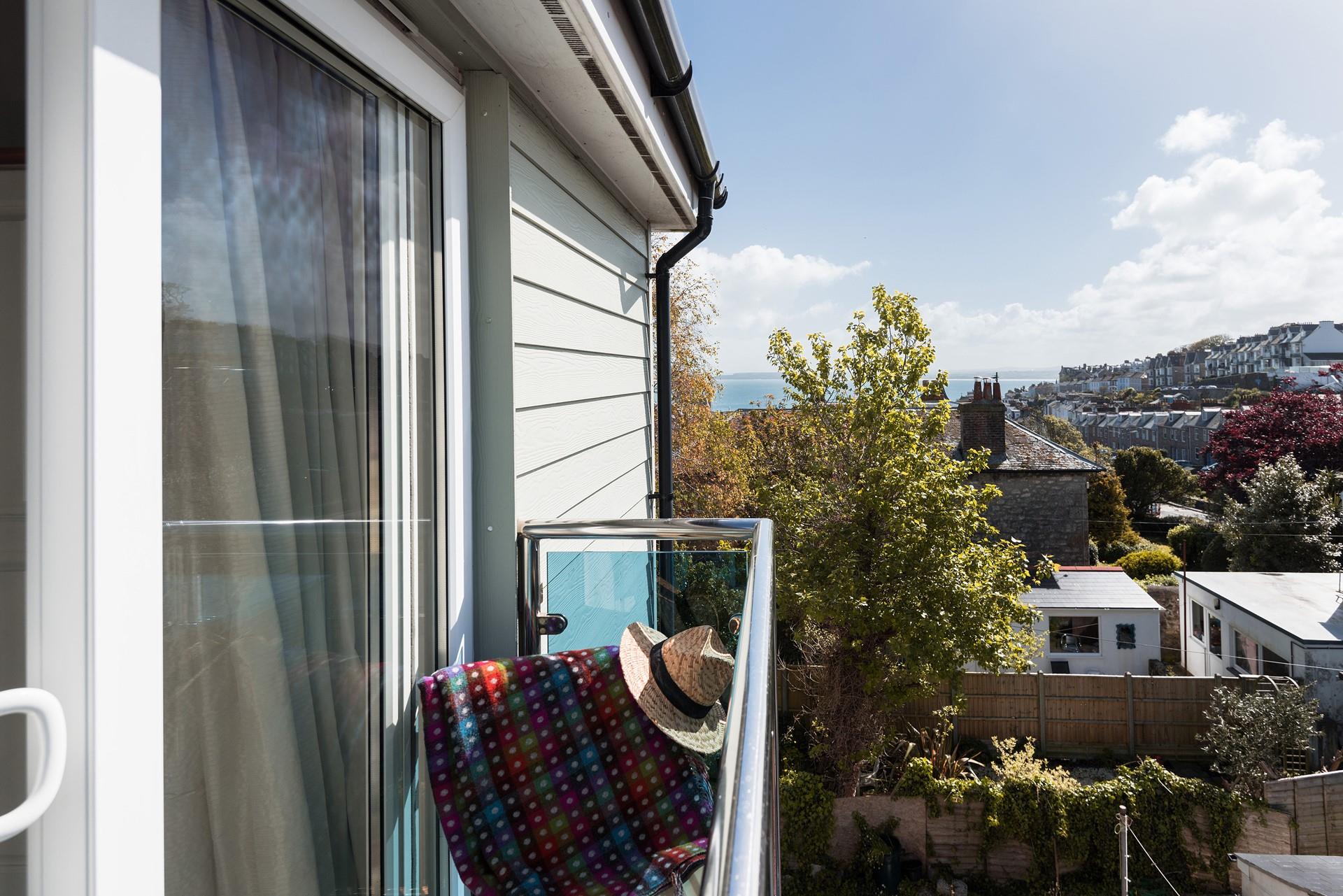 Enjoy sea views from your Juliette balcony while you sip something cold.