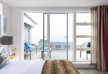 Step from your king size bed and onto the sea-view balcony.