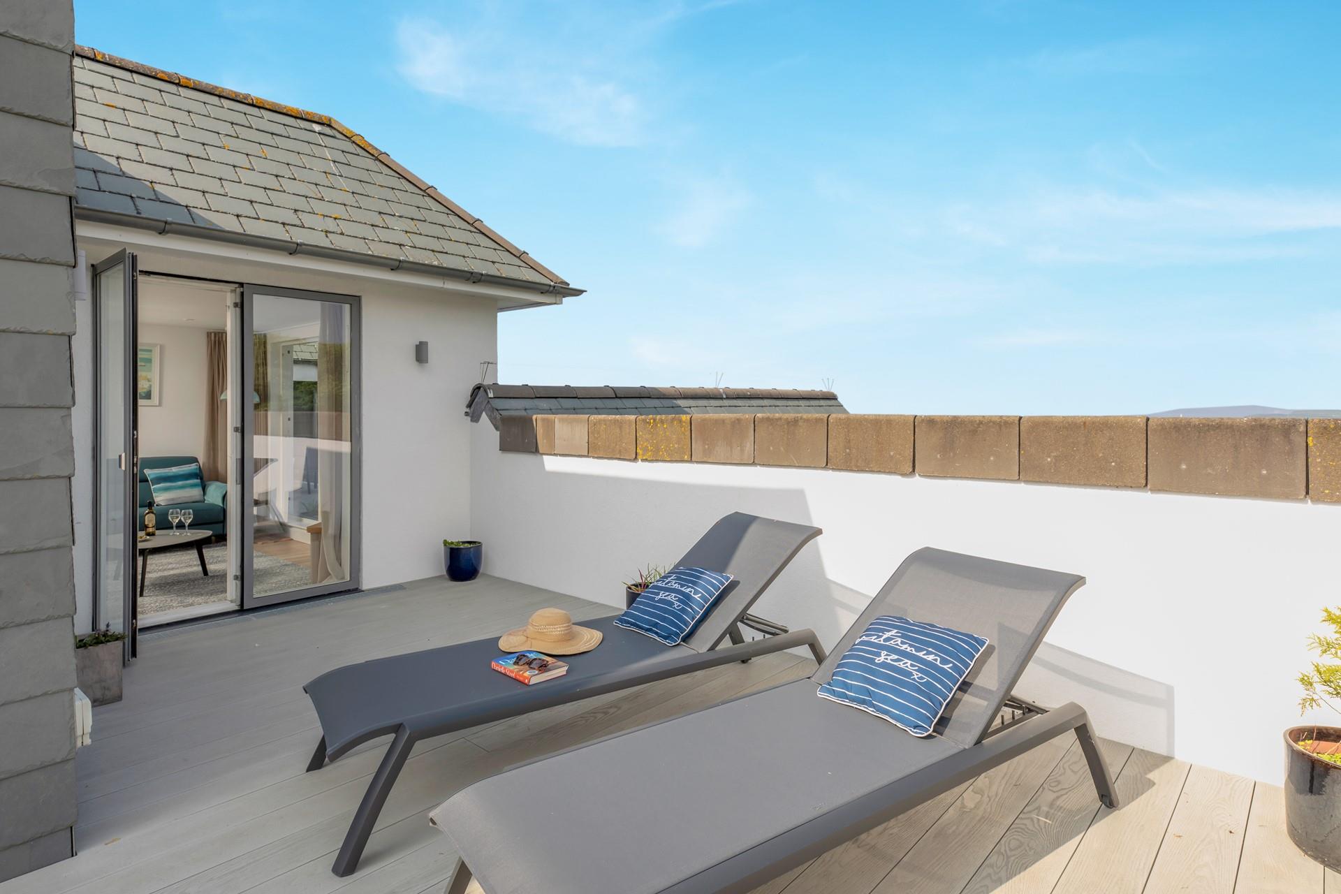 Relax together on the loungers after a busy day exploring the coast.