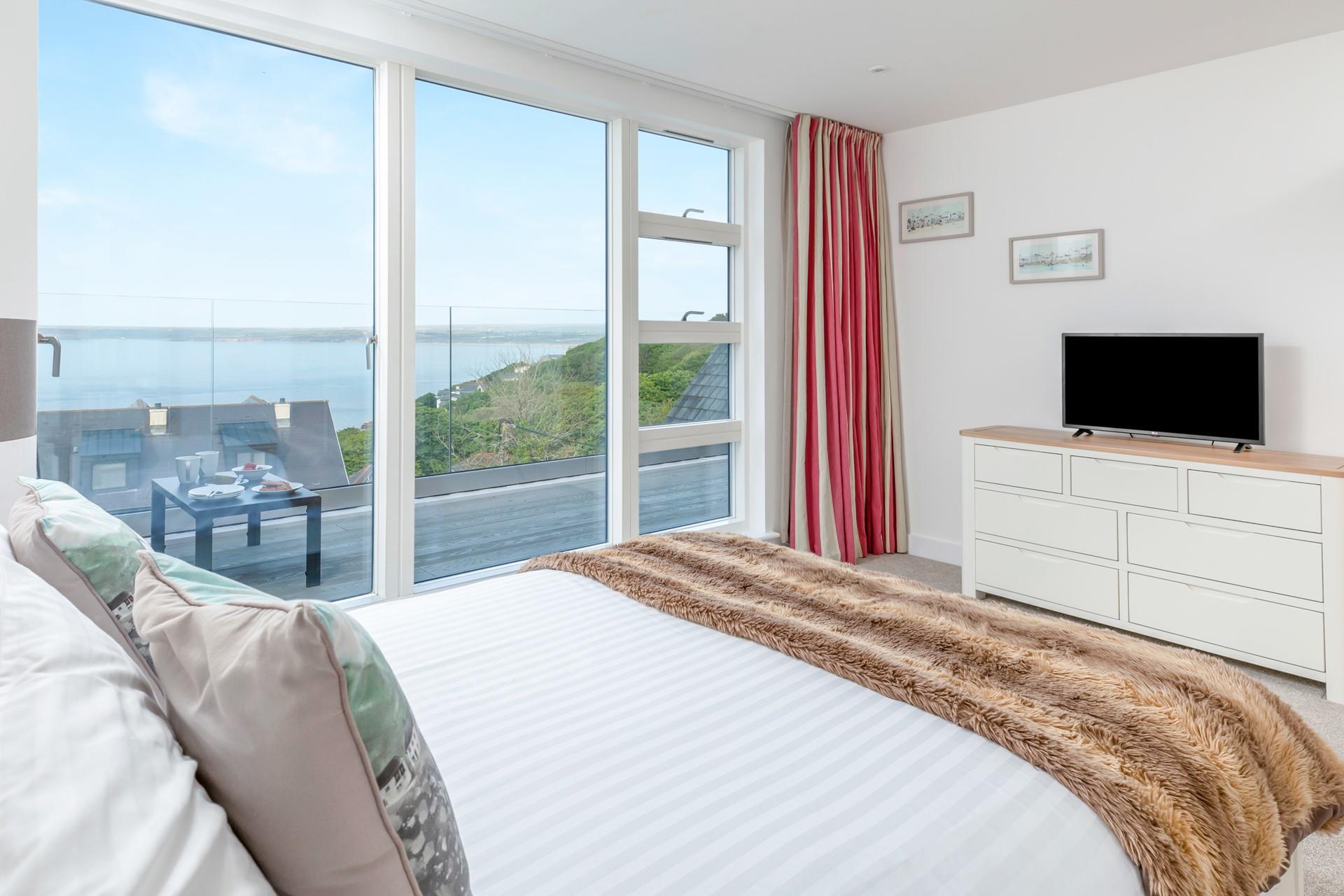 Open the balcony doors to let the sea air in as you plan the day ahead.