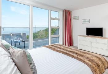 Open the balcony doors to let the sea air in as you plan the day ahead.