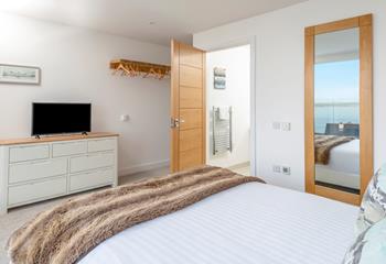 Step from your king size bed and onto the sea-view balcony.