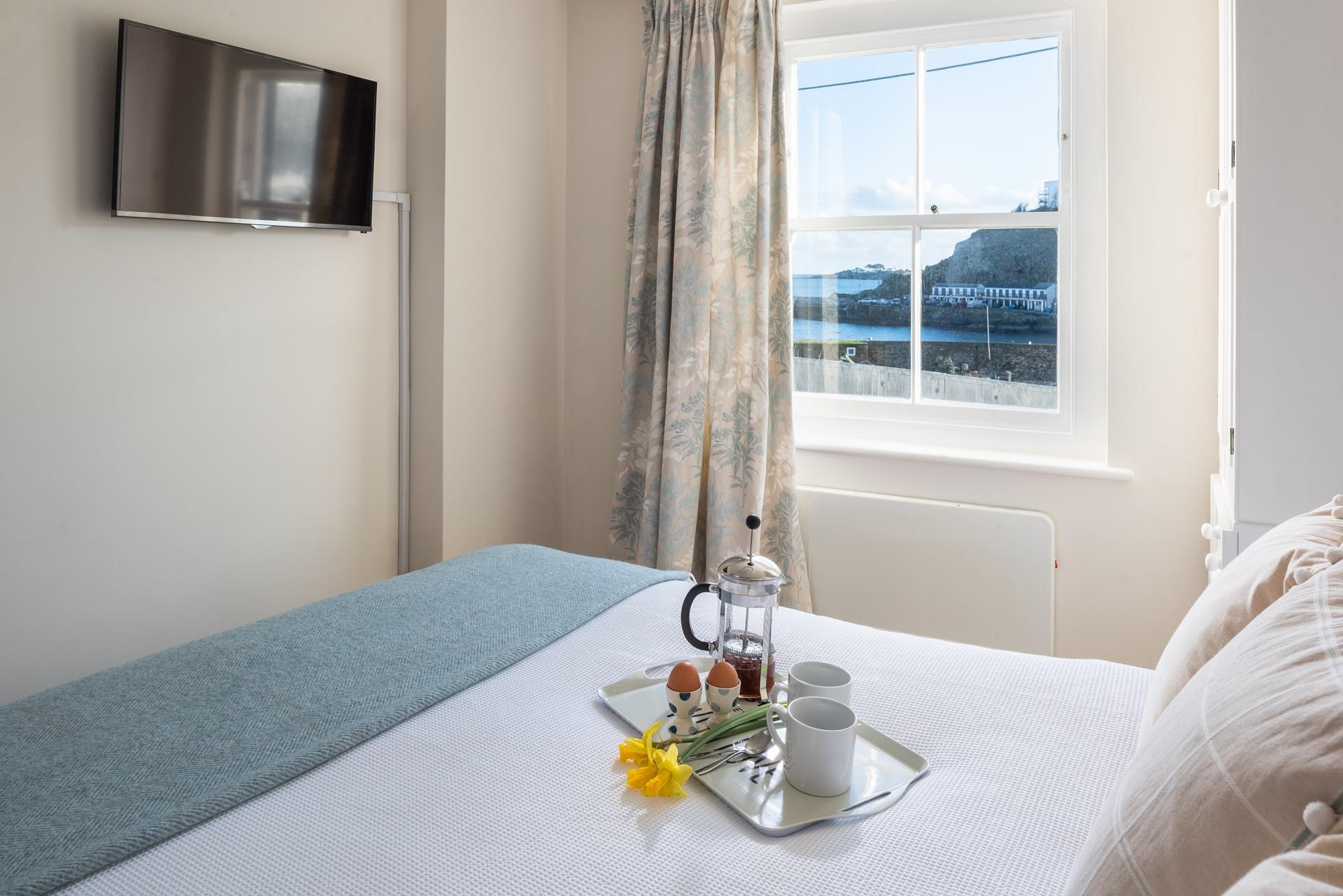 Enjoy a lazy morning in bed, watching the boats come and go. 