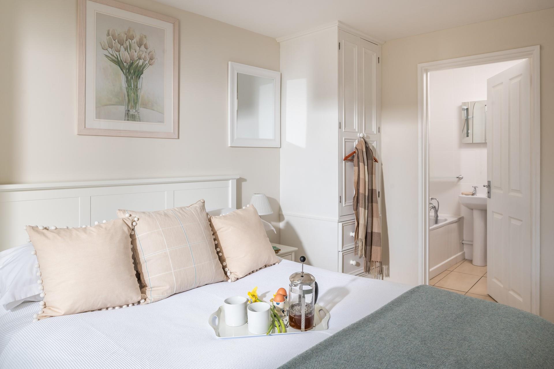 Elegant and sophisticated, the king size bedroom offers a retreat for guests. 