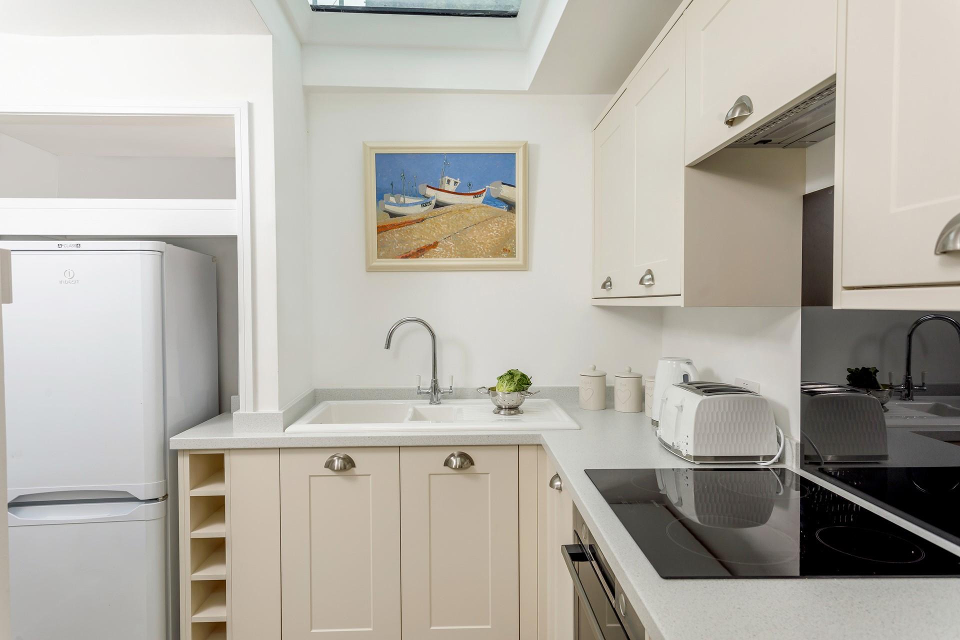 The contemporary kitchen gives a nod to the coastal location.