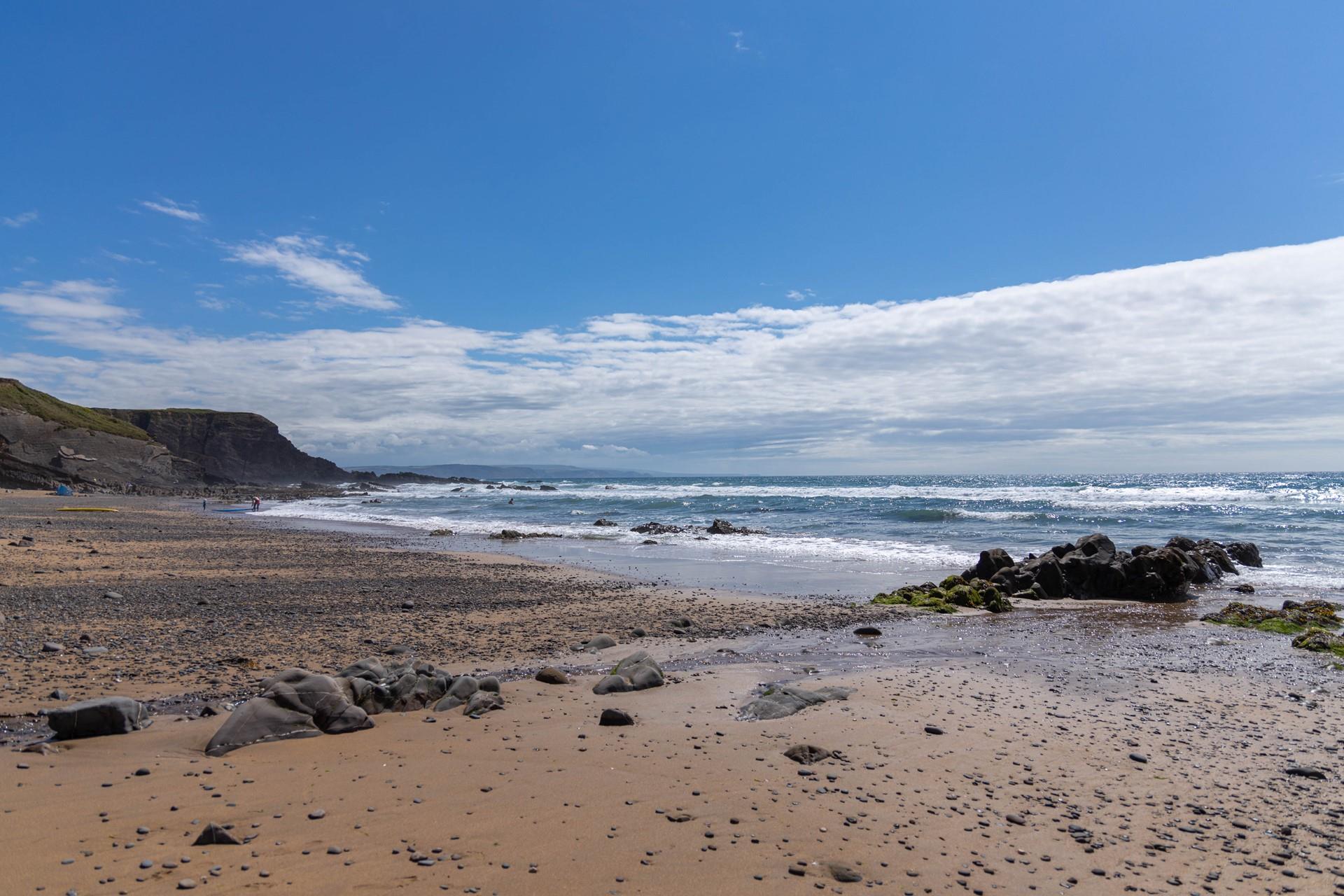Take a morning dip at Northcott Mouth Beach on a warm summer morning.