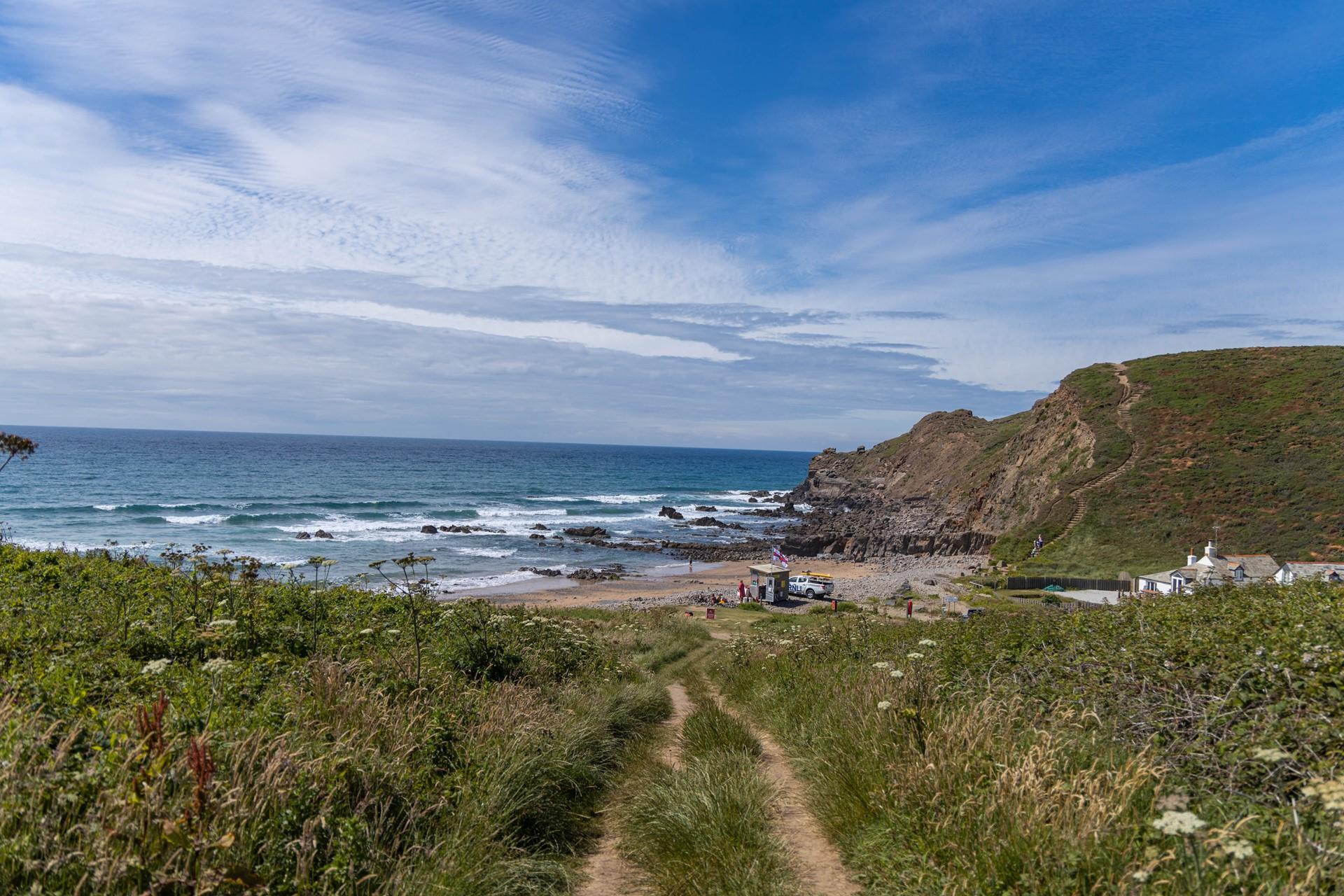 Take a walk down through the pretty country lanes to Northcott Mouth Beach.