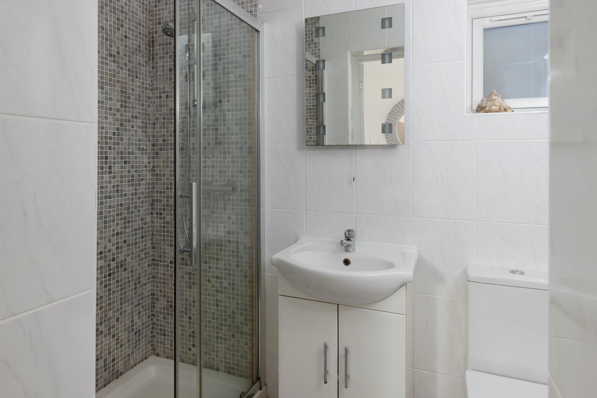 Get ready for a day on the beach nearby in the shower room.