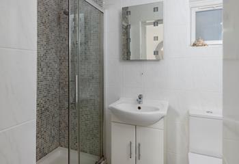 Get ready for a day on the beach nearby in the shower room.