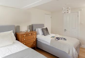 Bedroom 2 has super comfy twin beds and sumptuous cushions and throws.