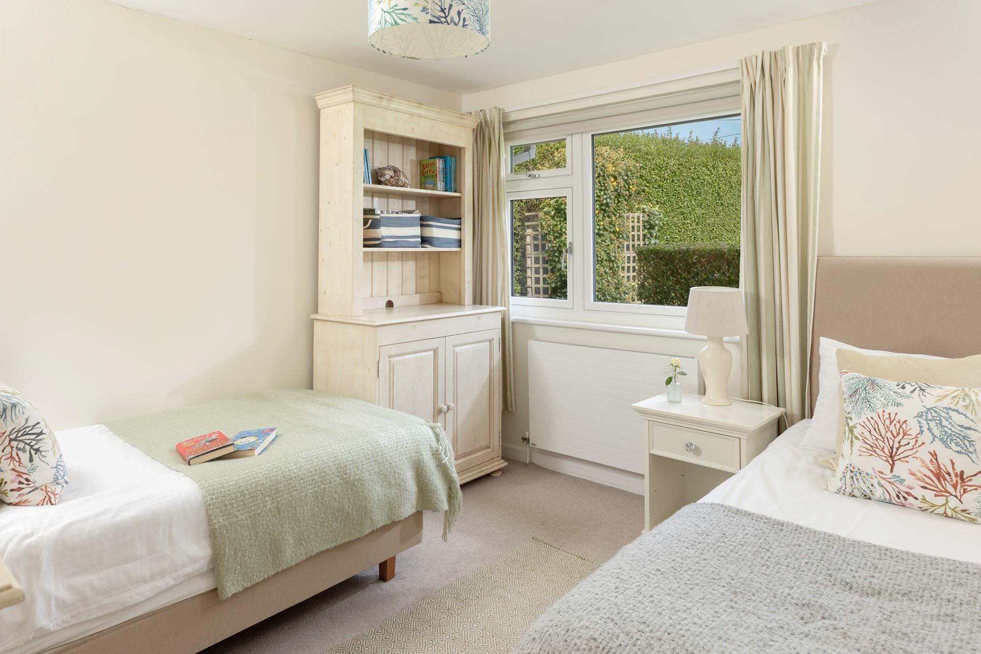 Bedroom 3 is stylishly decorated in pastel tones and is a relaxing base to come back to.