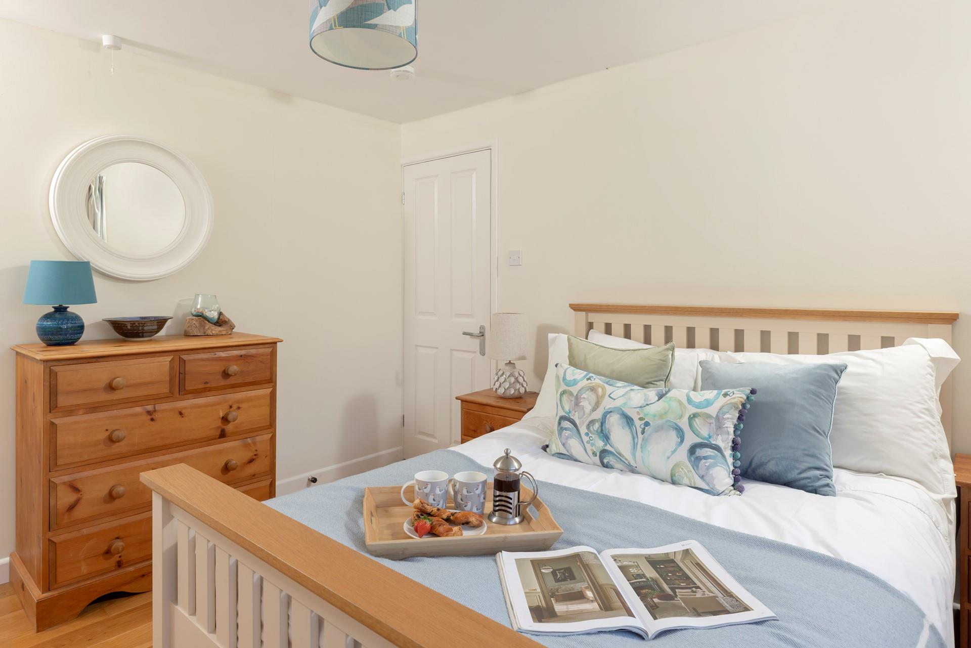 Calming tones of cream and blue feature in bedroom 4.