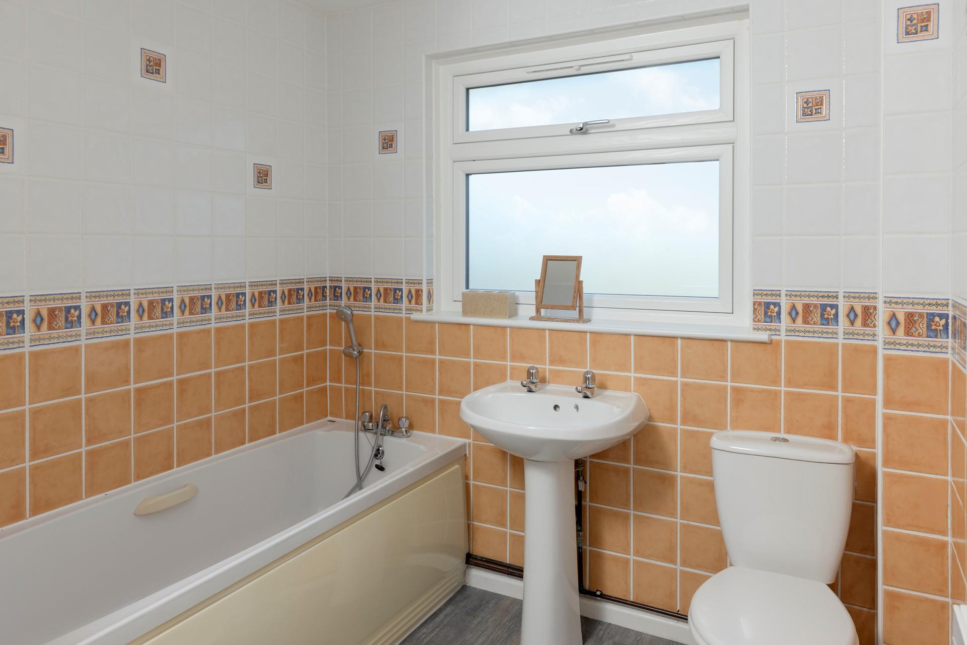 The family bathroom has a tub perfect for a relaxing evening!