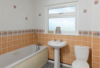 The family bathroom has a tub perfect for a relaxing evening!