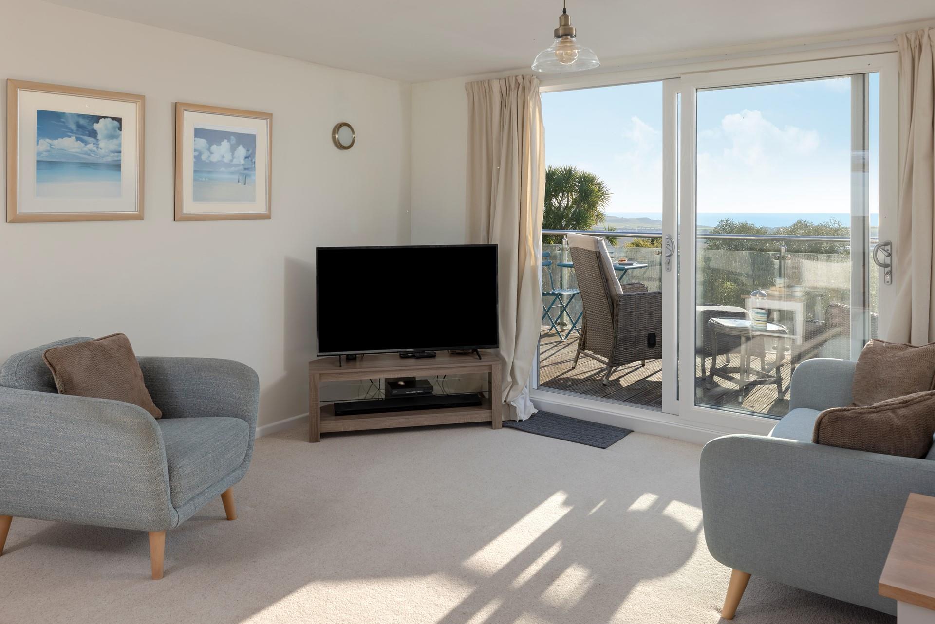 Head out to the balcony to enjoy al fresco drinks and dining.