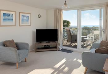 Head out to the balcony to enjoy al fresco drinks and dining.