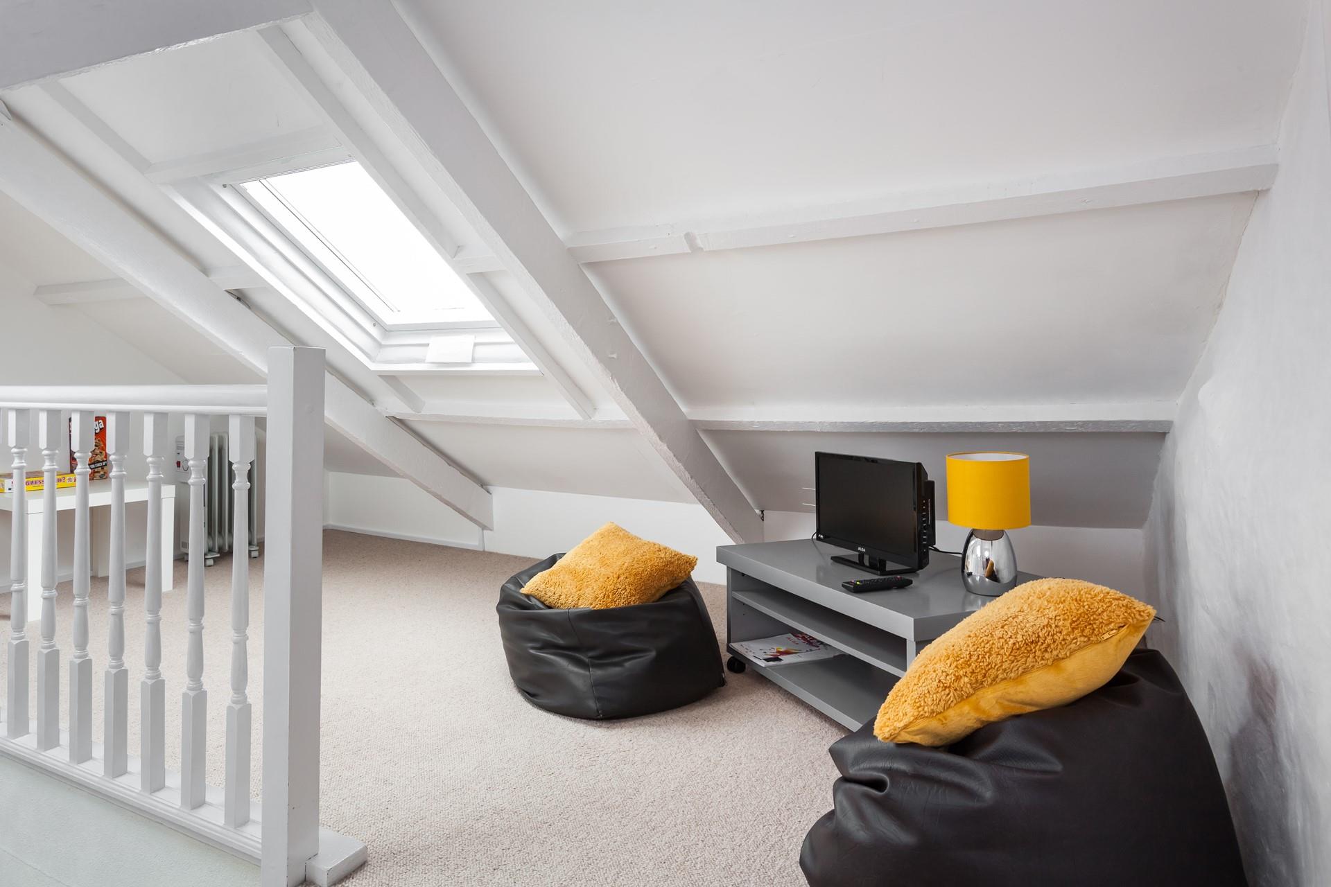 The snug is ideal for kids, offering them their own space to relax and play games.