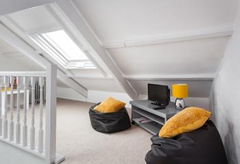 The snug is ideal for kids, offering them their own space to relax and play games.