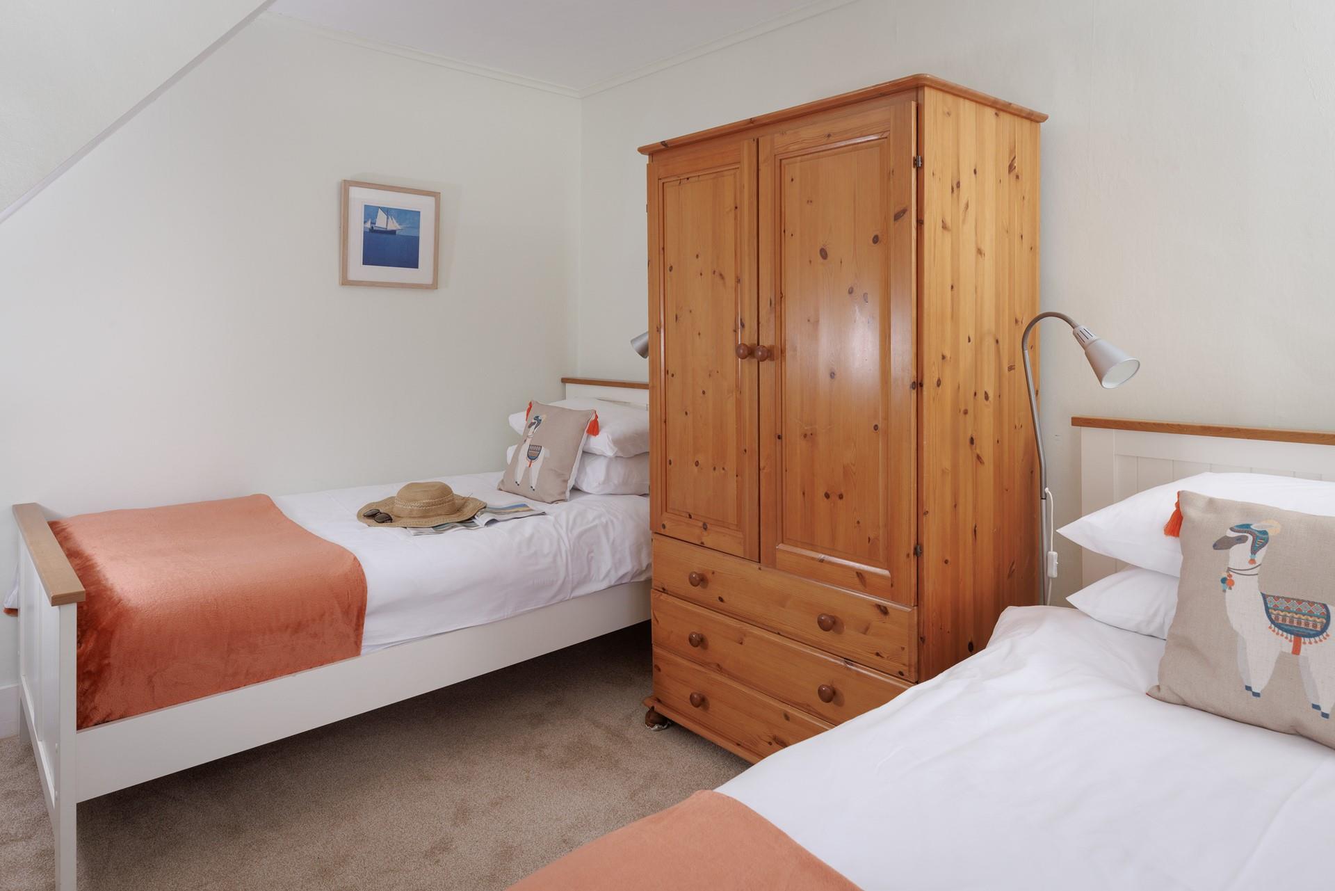 Twin beds with fun pops of colour are perfect for children.