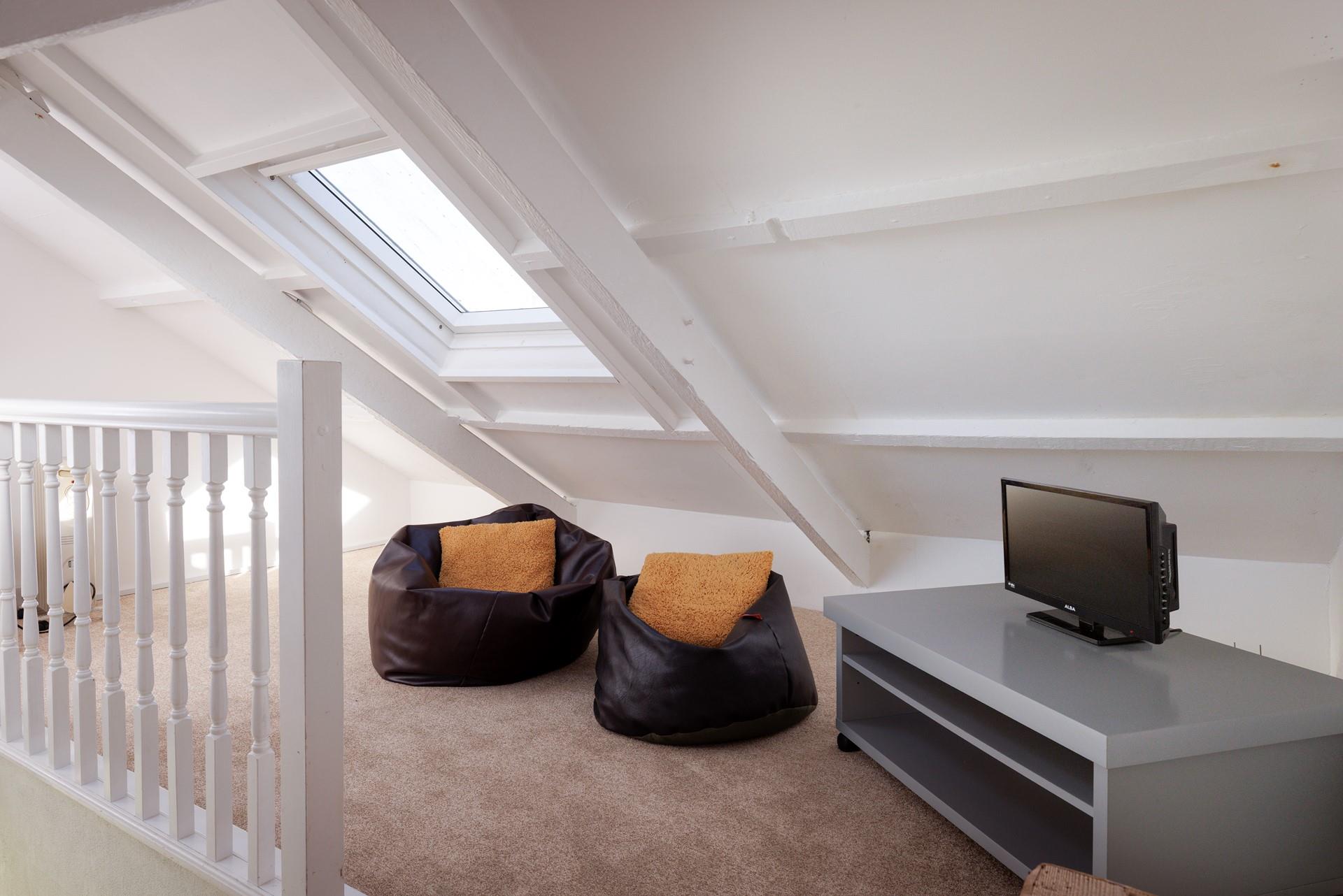 The snug is ideal for kids, offering them their own space to relax and play games.