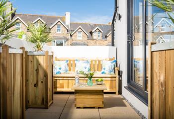 Unwind on the patio, a lovely sheltered area for sitting in the sun.