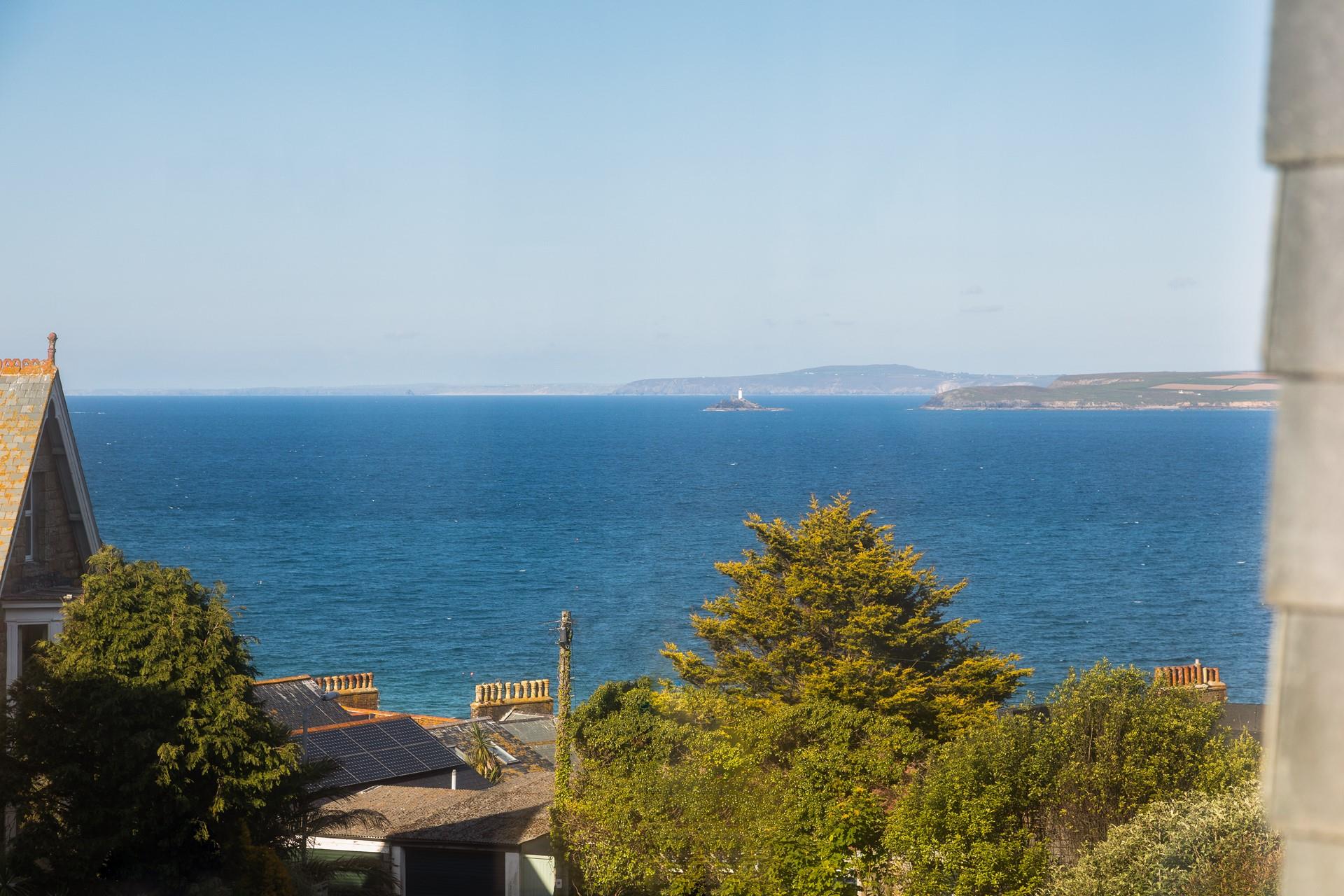 Gaze out at the turquoise waters of the Bay with a glass of something cold in hand.