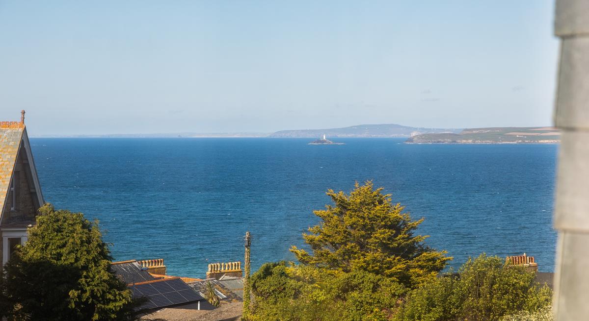 Gaze out at the turquoise waters of the Bay with a glass of something cold in hand.