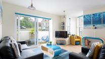The sitting room is bright and cheerful, the perfect base to return to each evening.