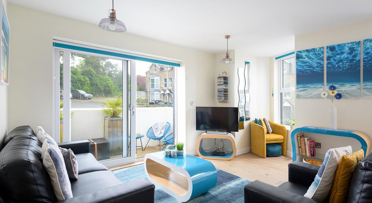 The sitting room is bright and cheerful, the perfect base to return to each evening.