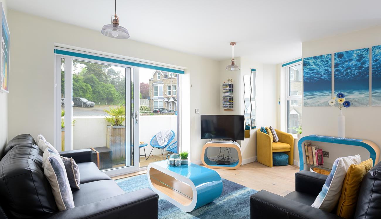 The sitting room is bright and cheerful, the perfect base to return to each evening.