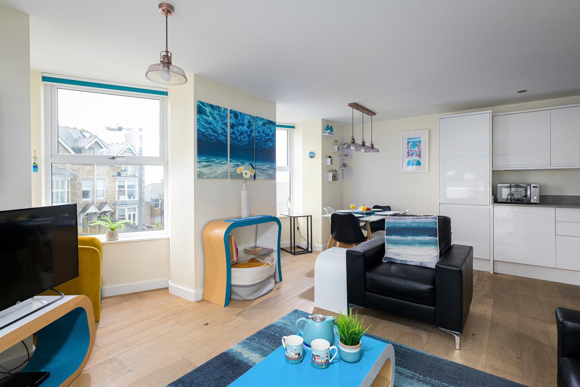 The open plan living space is perfect for spending quality time as a family.