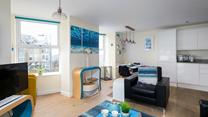 The open plan living space is perfect for spending quality time as a family.