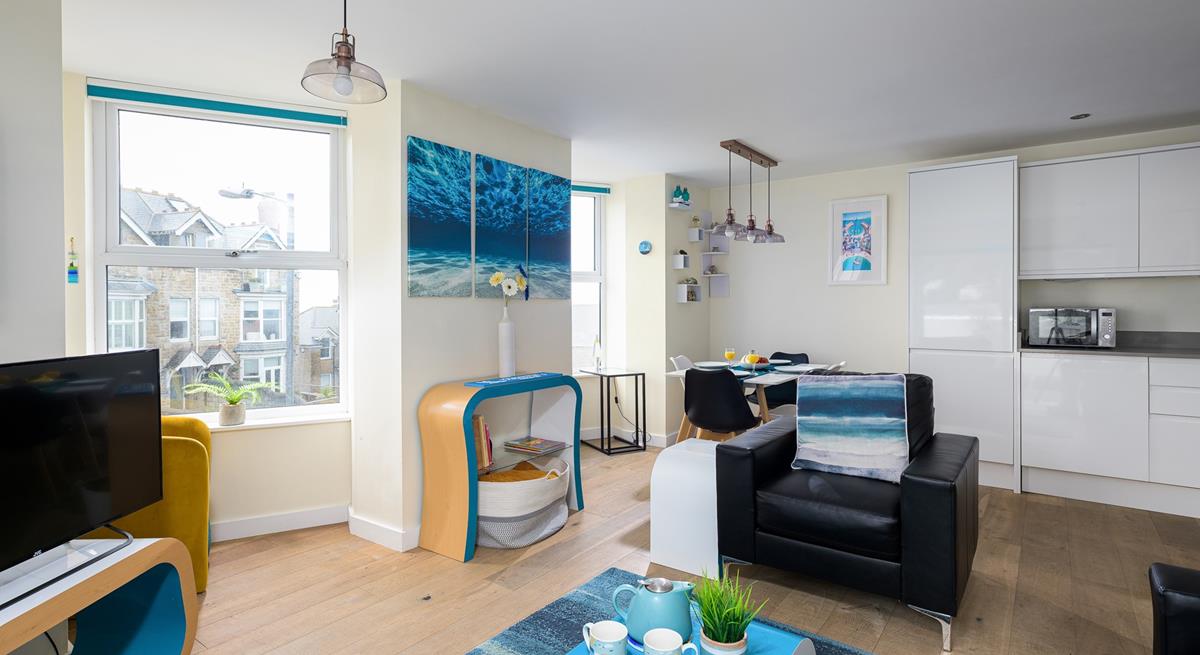 The open plan living space is perfect for spending quality time as a family.