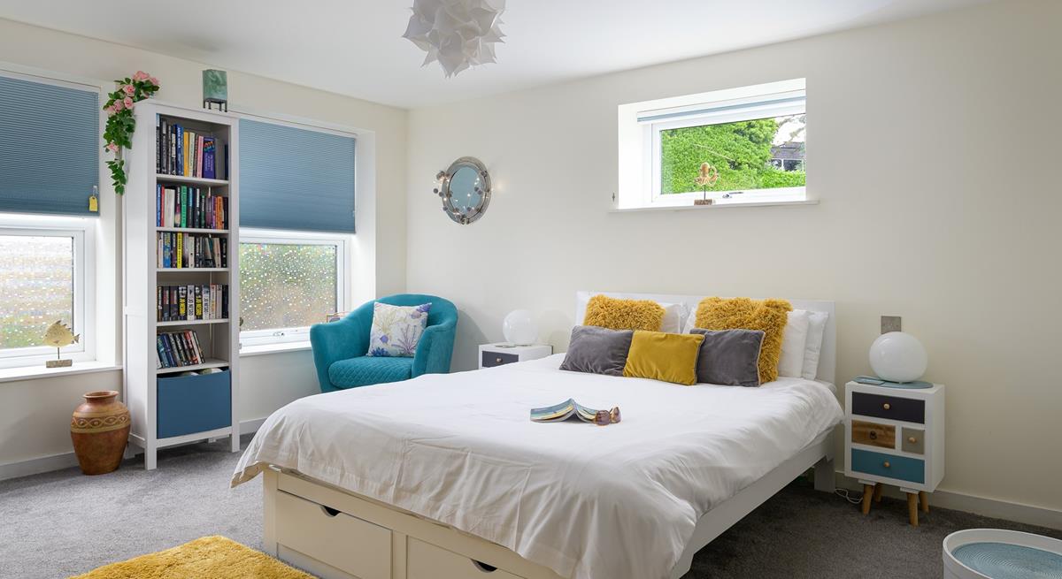 Bedroom 1 has a spacious king size bed to tuck into each evening for a relaxing night's sleep.