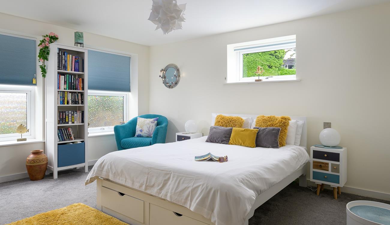 Bedroom 1 has a spacious king size bed to tuck into each evening for a relaxing night's sleep.