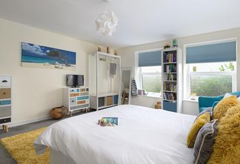 Bedroom 1 is spacious with pops of colour, the perfect place to rest each night.