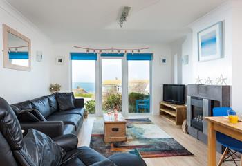 Wake up to the stunning view over Porthmeor, with floor to ceiling windows and a patio door this sitting area never struggles for natural light. 