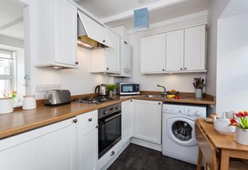 Though compact the kitchen is fantastically well-equipped with modern appliances.