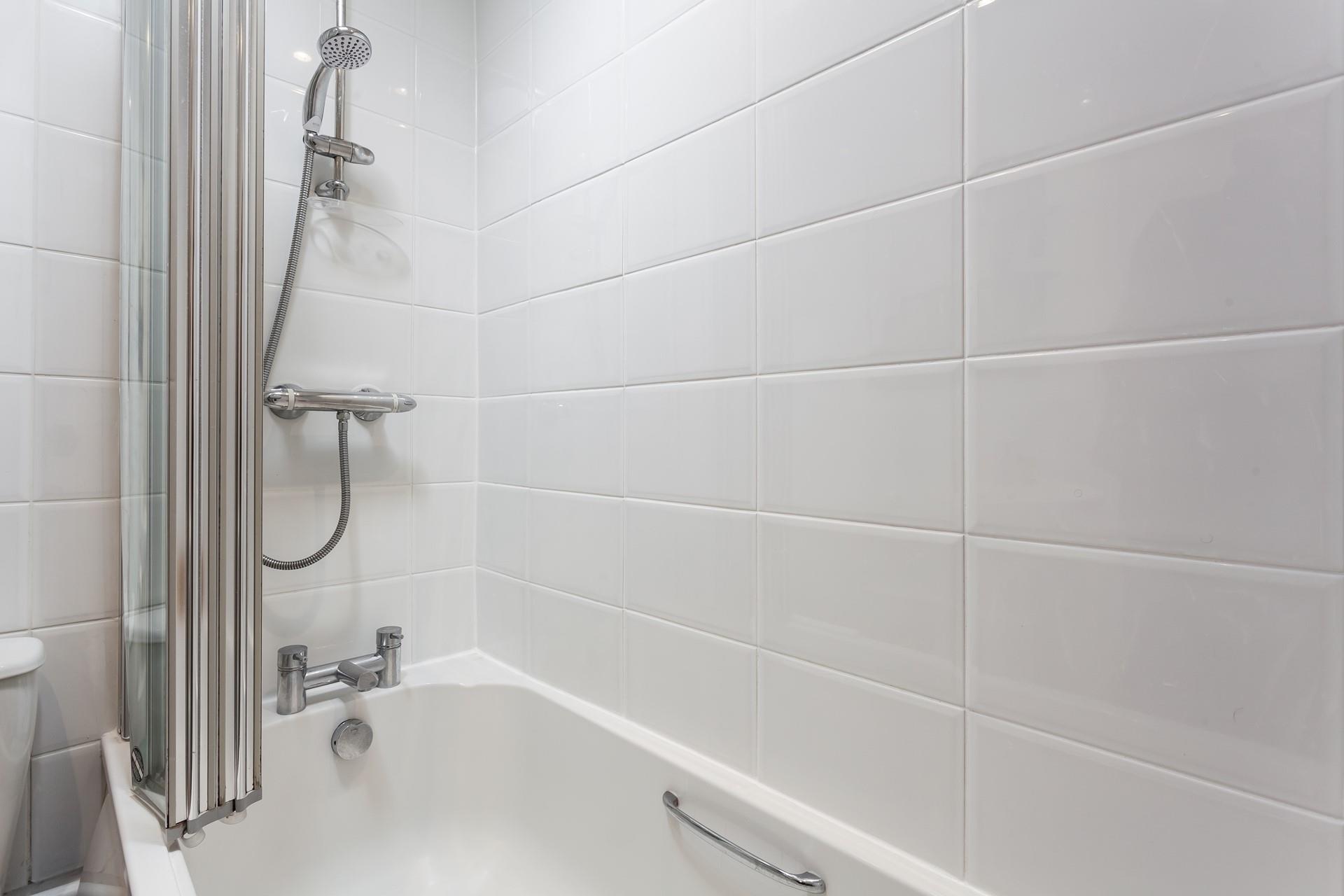 Wash off sandy toes in the shower after a day on Porthmeor.