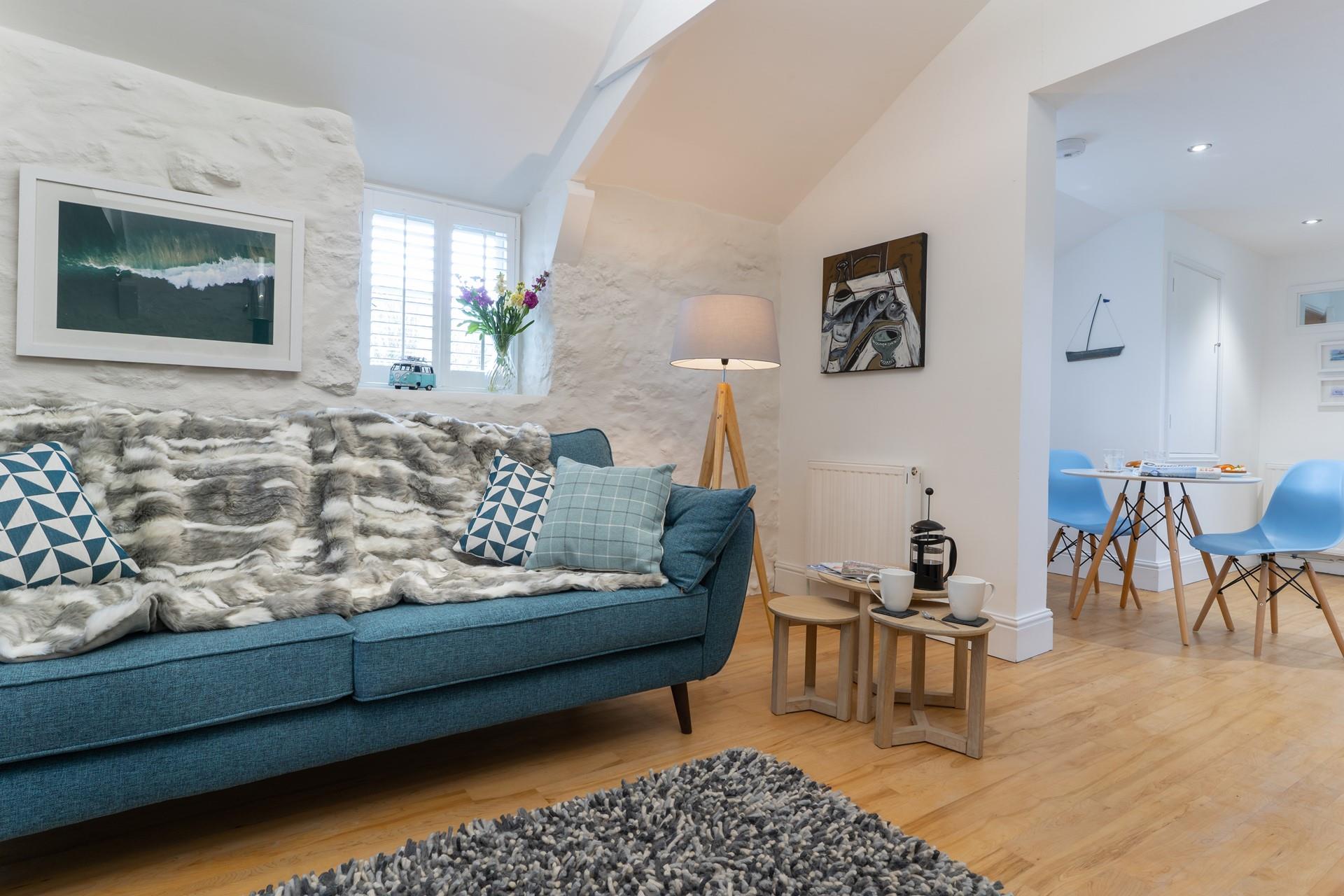 Interior features made from local driftwood and beachy shades incorporate the Cornish surroundings into the interior. 