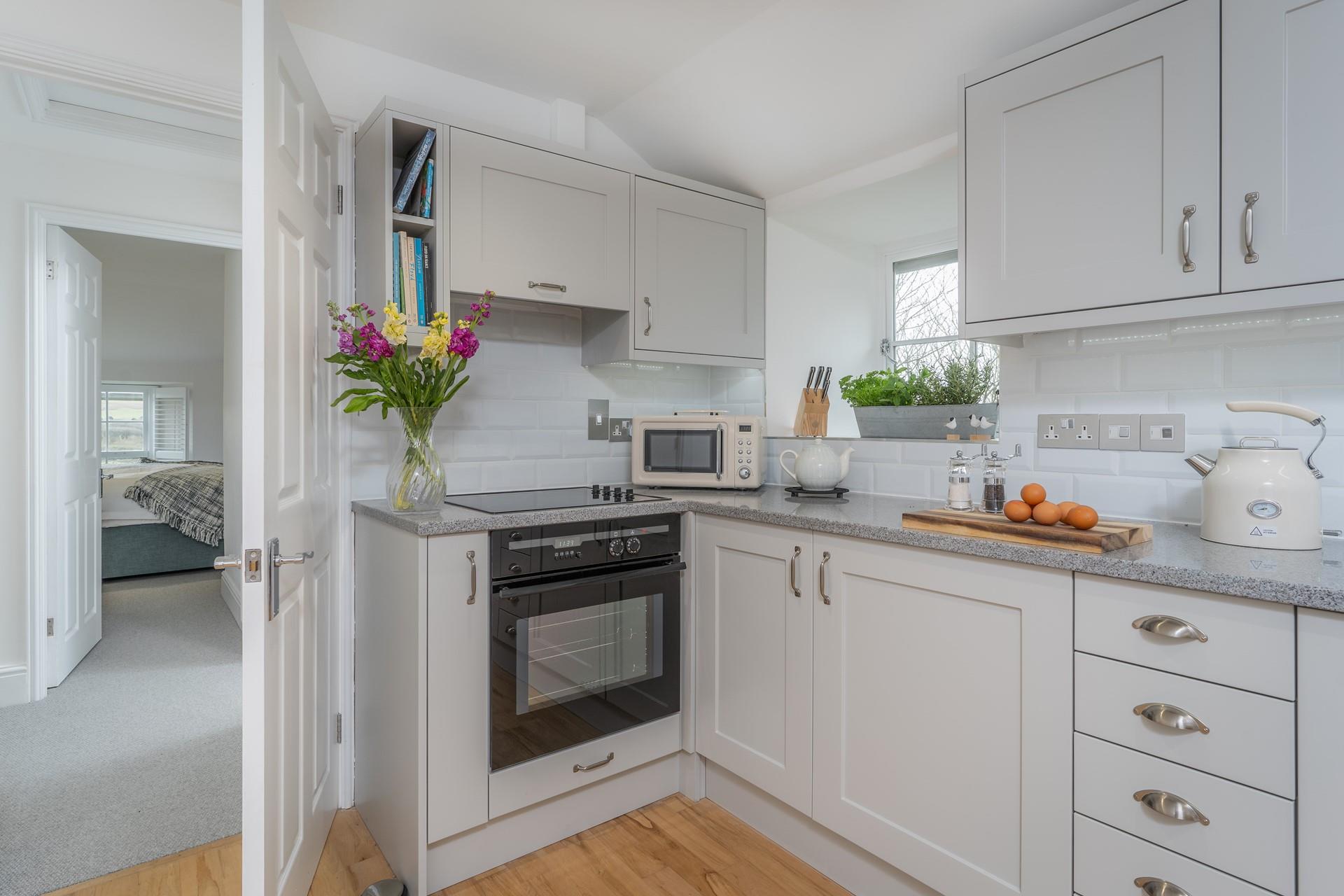 The modern kitchen is fully equipped for all your culinary needs.